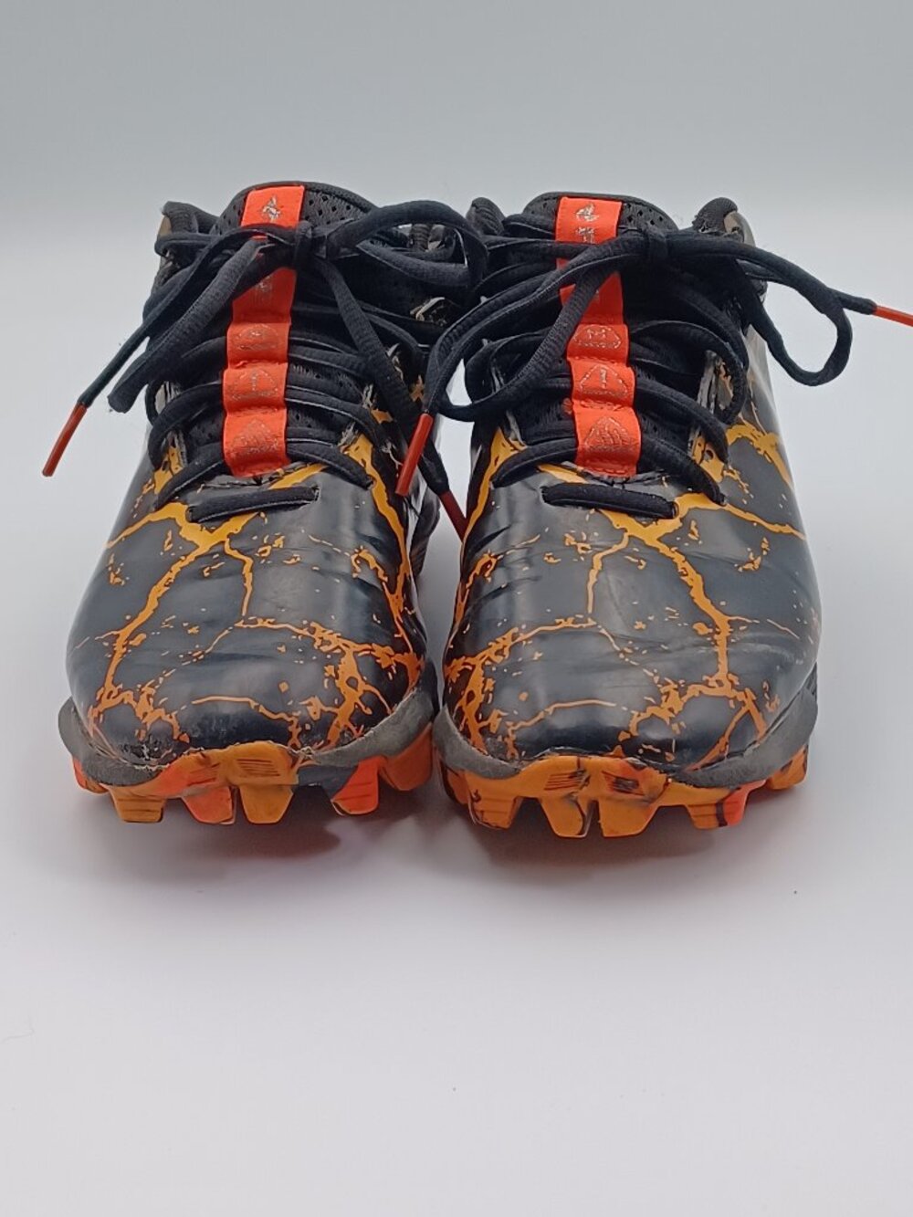 Under Armour Youth size 3.5 Cleats Black & Orange & Gold Pre-owned